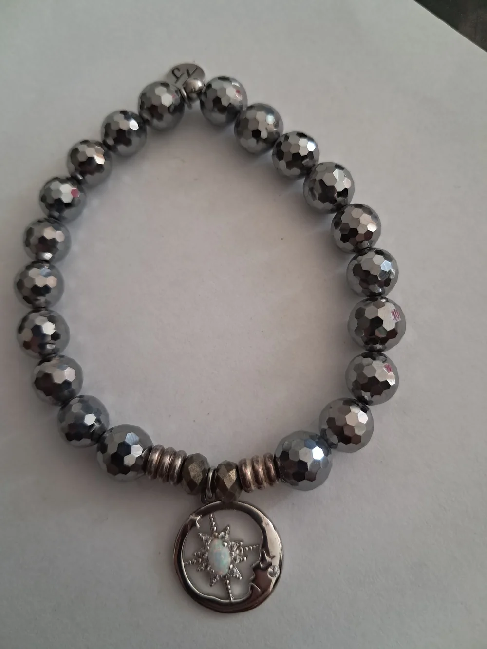 T. Jazelle Faceted Hematite Bracelet - Celestial Sun & Moon Charm